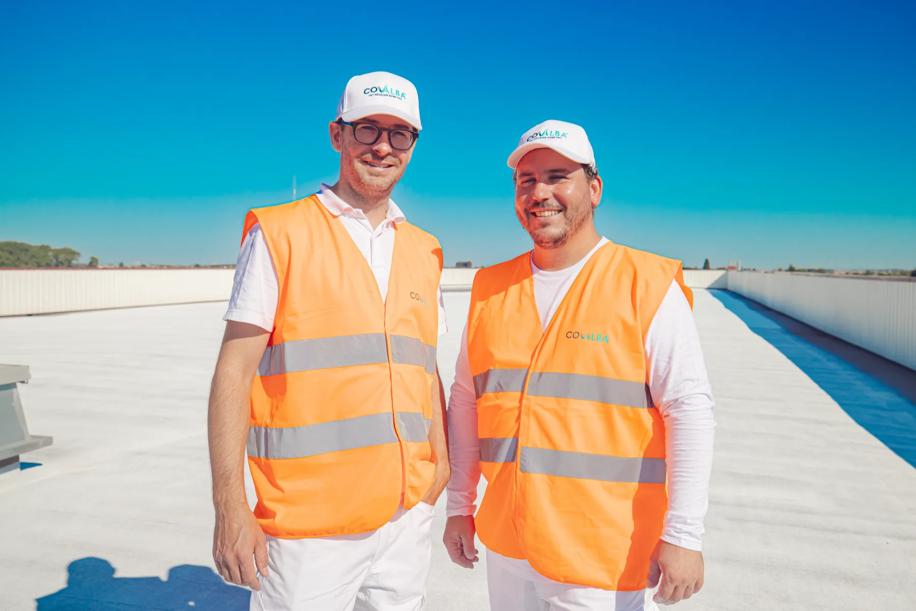 Maxime and Bertrand, Covalba founders, on a roof