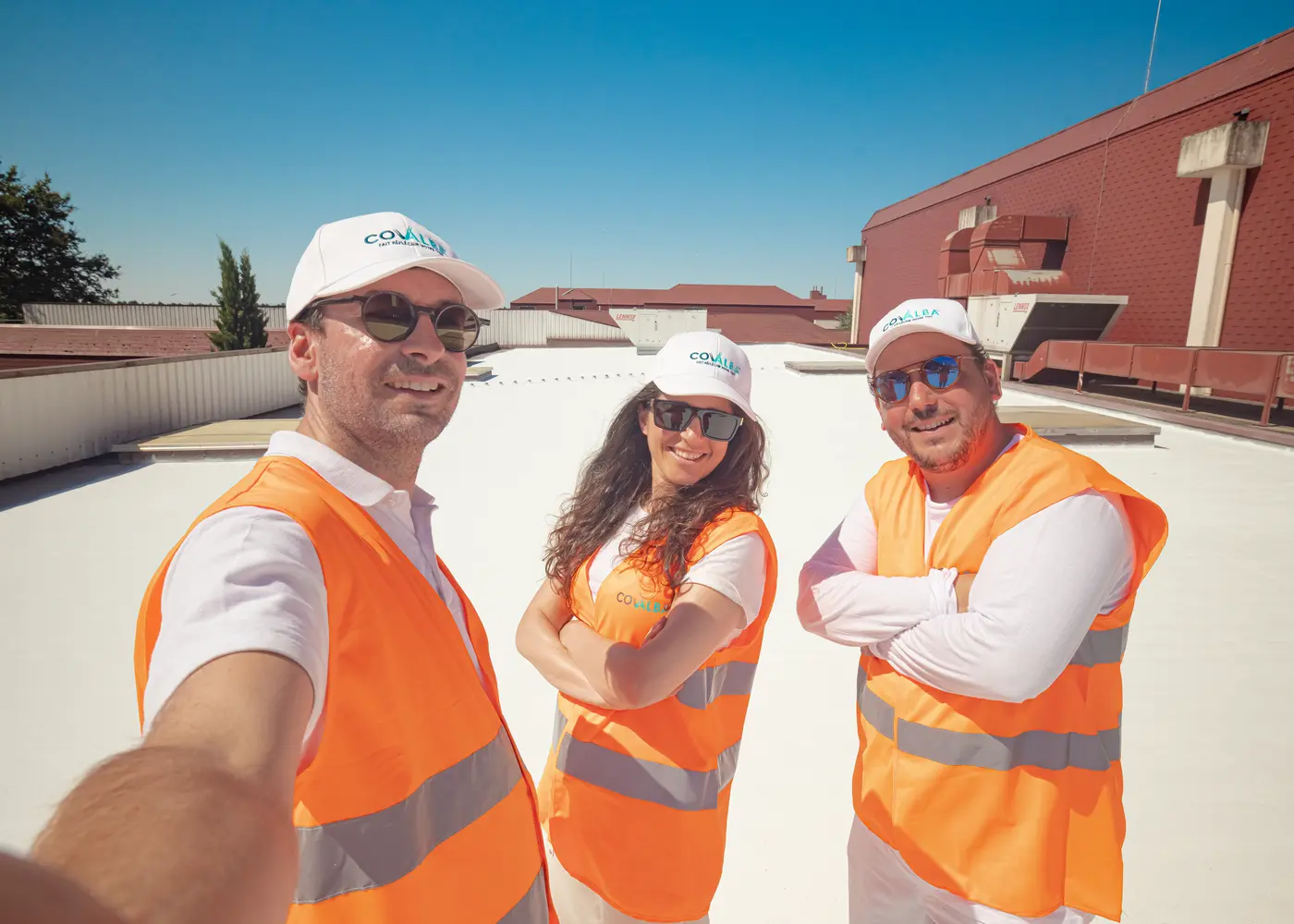 Covalba team on white roof after application