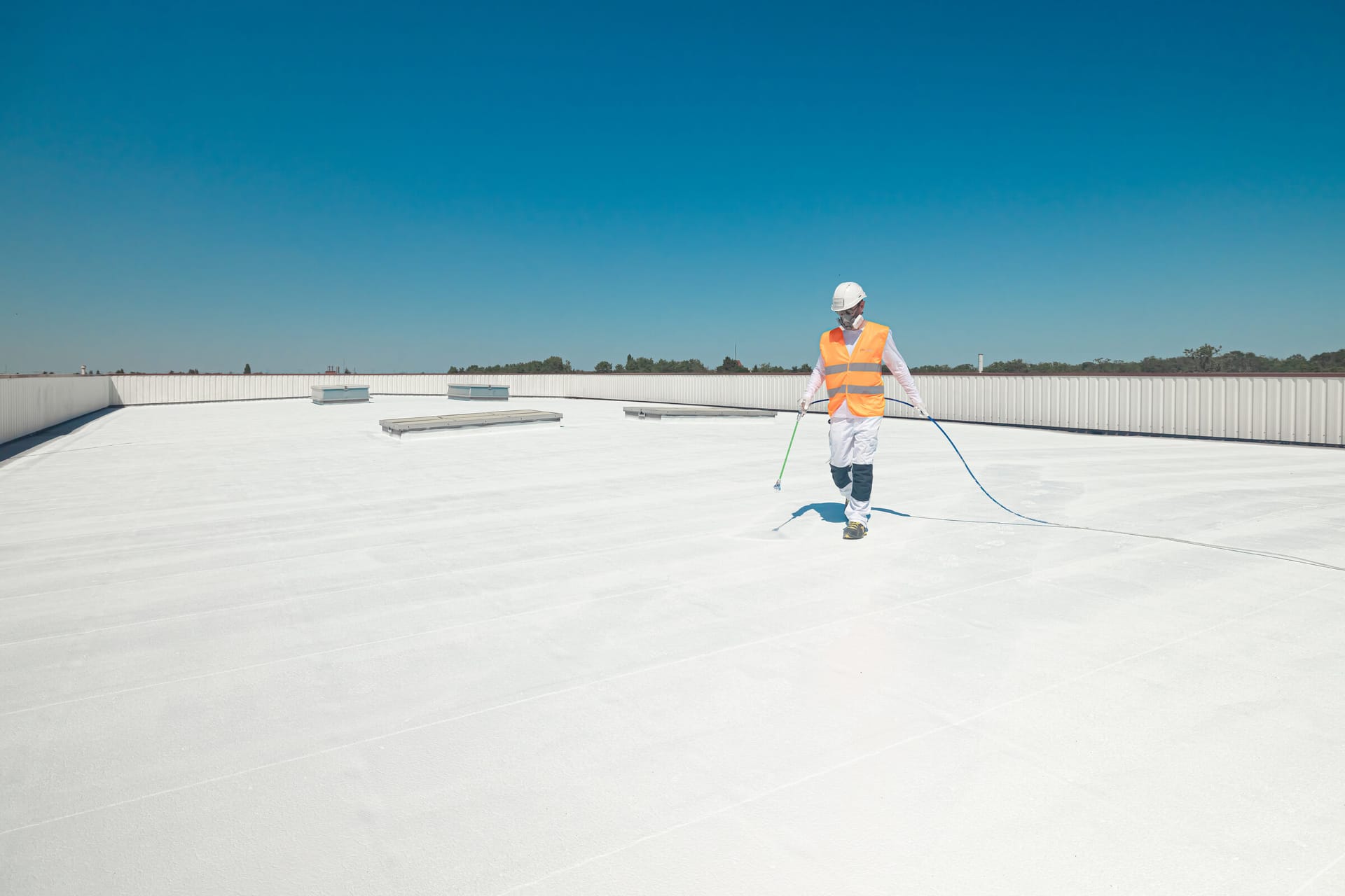 Spray application of a Covalba cool roof coating